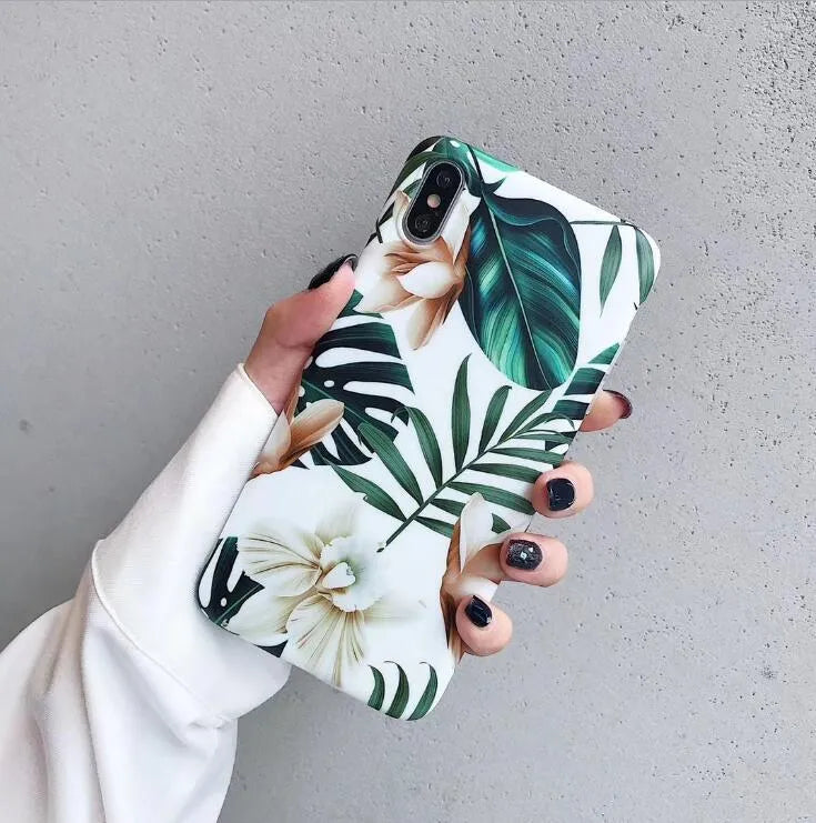 Floral banana leaf art design on a soft TPU phone case for iPhone models.