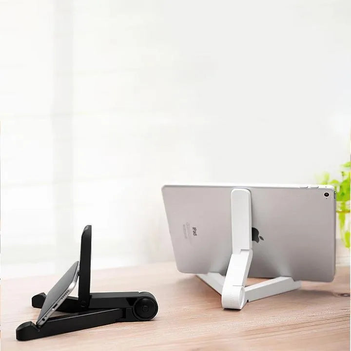 Black foldable aluminium tablet holder showing adjustable stand in open and closed positions on a desk.
