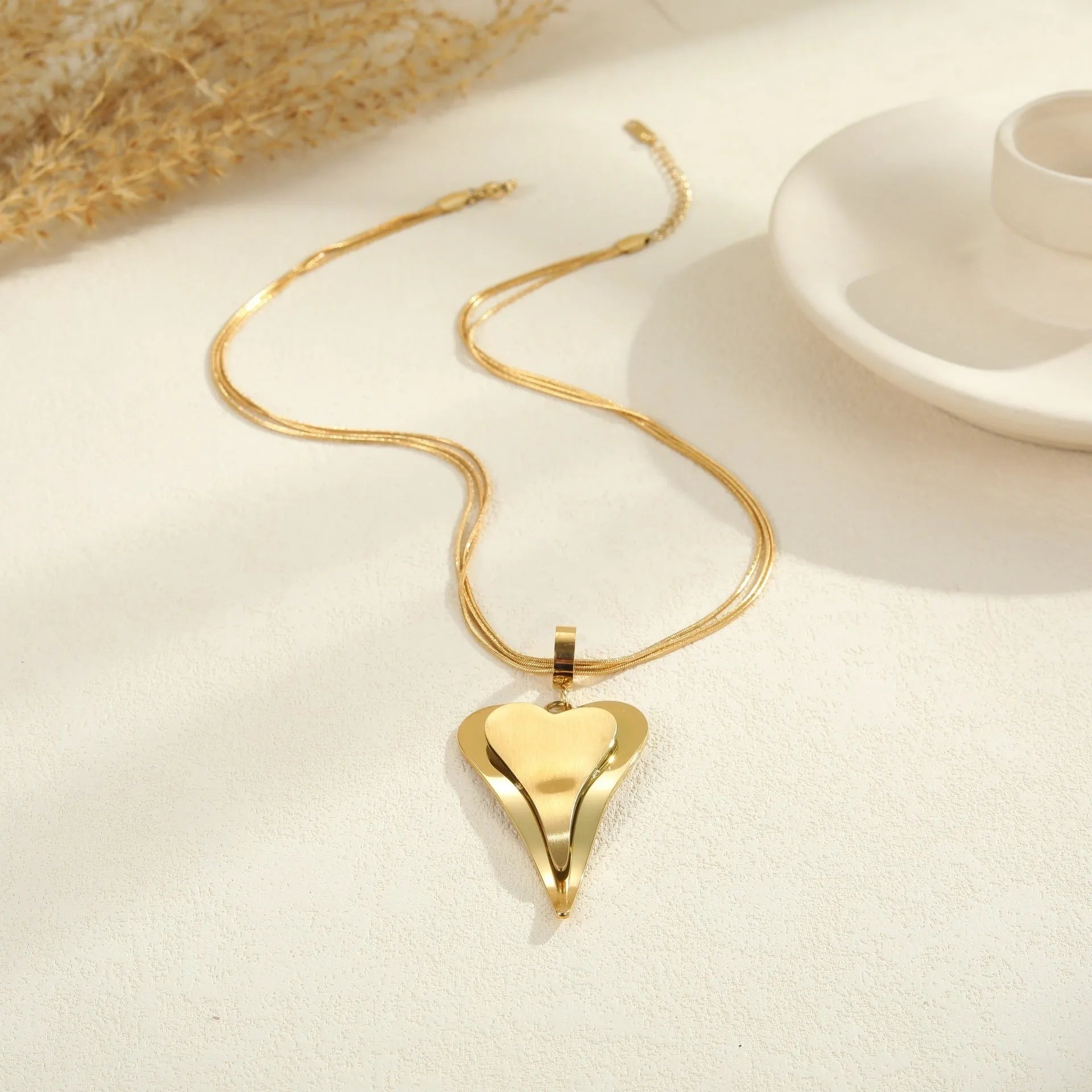 Stainless steel double heart snake bones chain necklace with geometric pendant in gold or steel colour