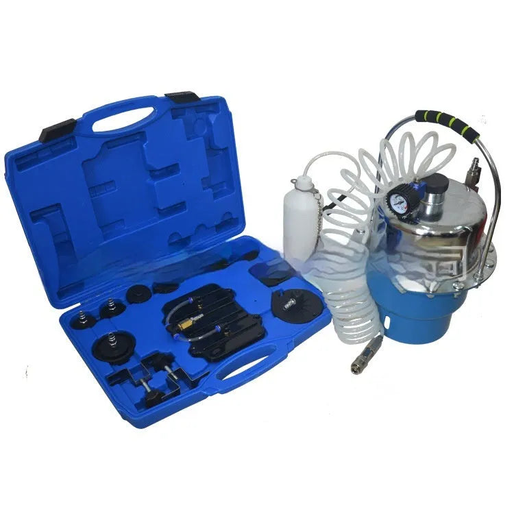 Pneumatic brake fluid replacement tool with 5L tank, pressure gauge, adapter kit, collection bottle, and fluid hose on a workbench