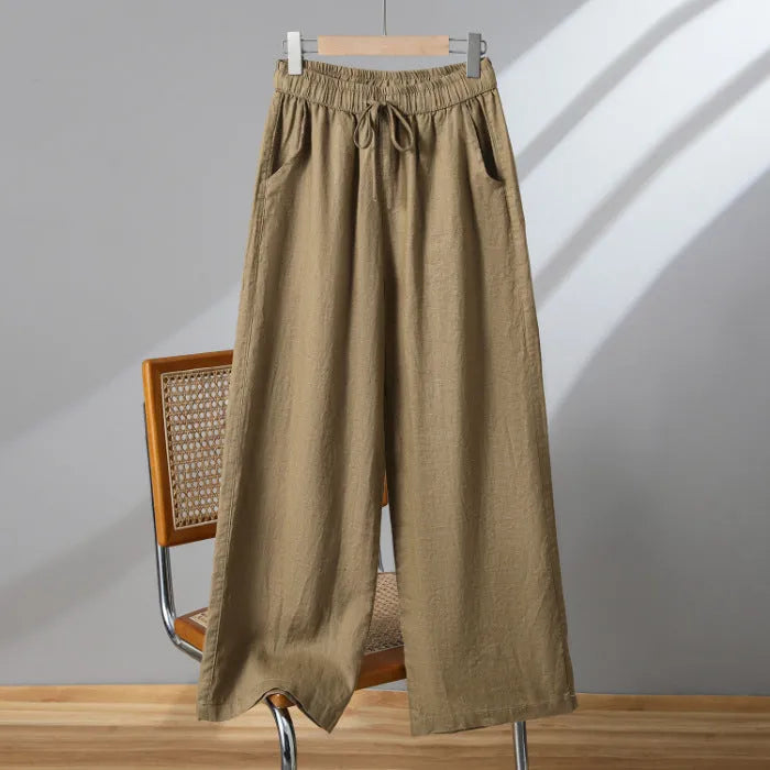 Women's straight leg casual trousers in khaki with an elastic waistband and lace-up drawstring detail.
