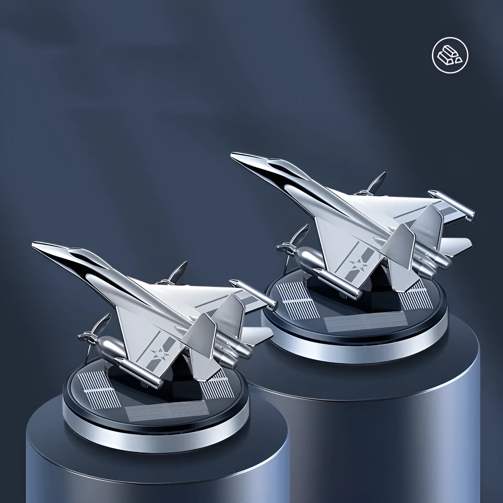 Silver solar powered rotating fighter plane air freshener ornament on a car dashboard.