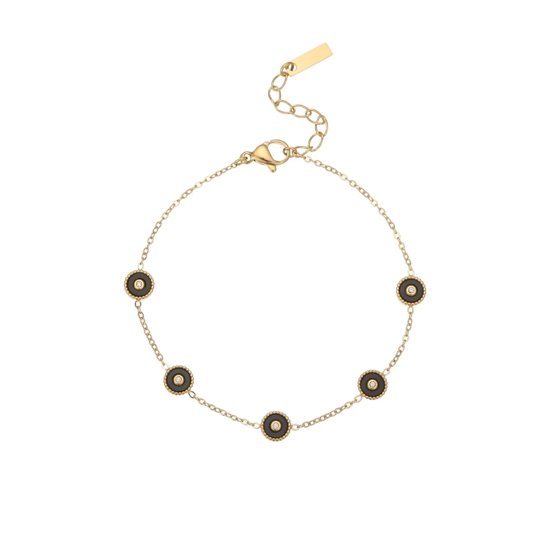 Close-up of a women's geometric fritillary pattern bracelet and necklace set in gold-plated stainless steel.
