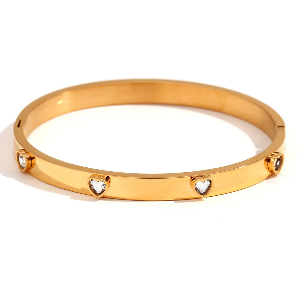 Stainless steel women's bracelet with a micro-inlaid peach heart in green or white diamond colour.