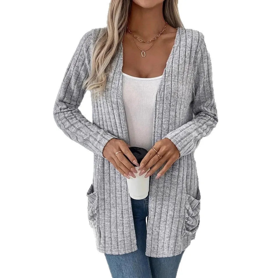 Solid colour long sleeve cardigan with front pockets in loose oversized fit