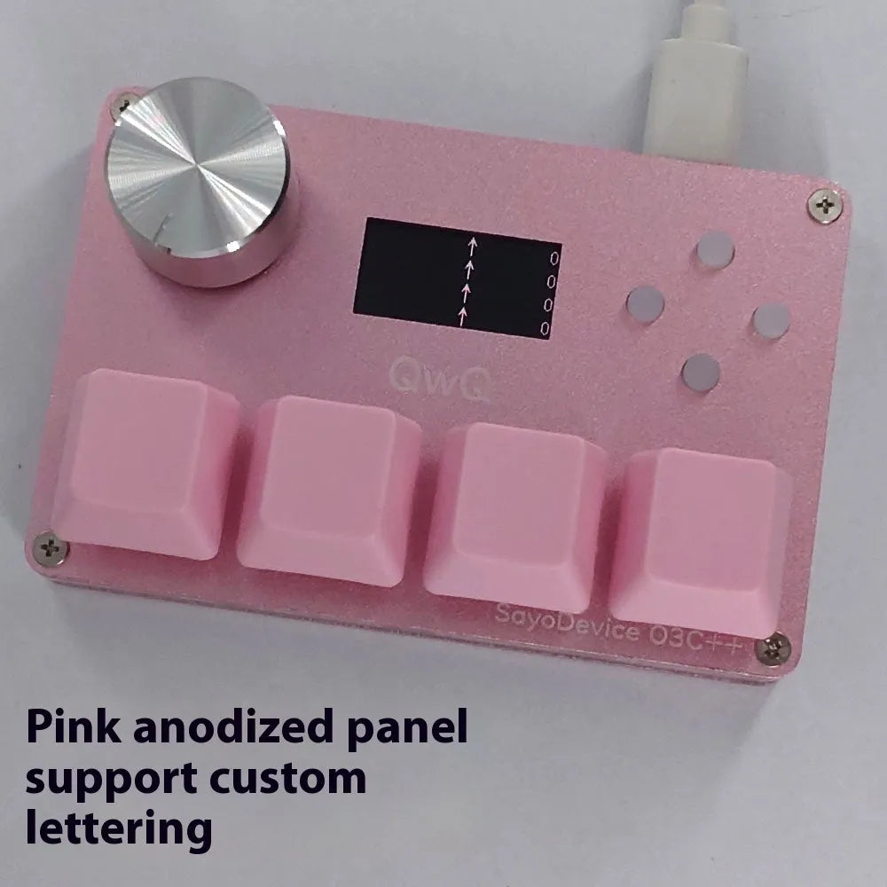 Customisable magnetic axis gaming keypad with programmable knob and colour IPS screen on desk.