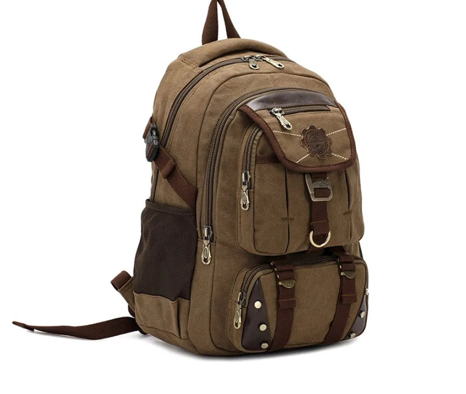 Canvas computer backpack in black with square vertical shape, zip closure, and multiple pockets