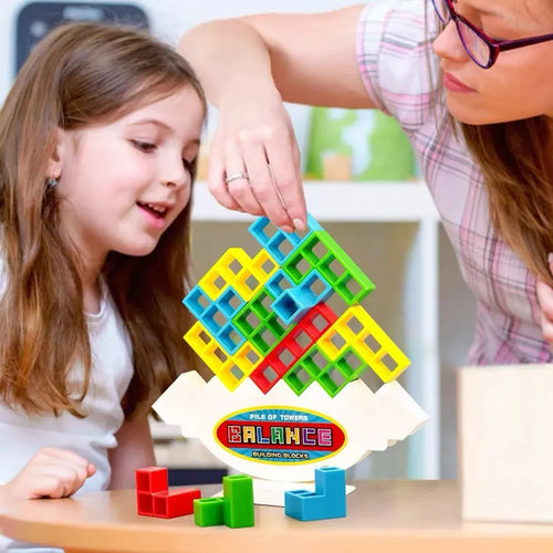 Balance stacking game with 16 plastic building blocks, chassis, and base on a table
