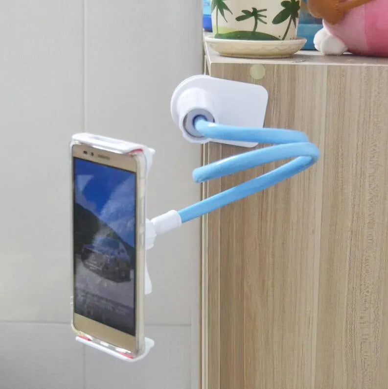 Black bedside phone holder with a long metal arm and adjustable plastic head gripping a mobile phone.