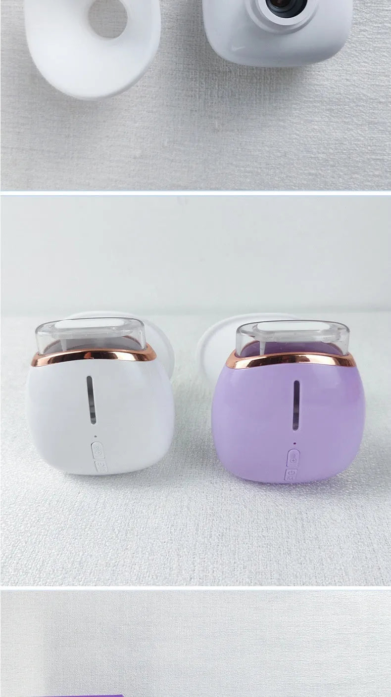 White and purple portable eye humidifier with charging cable on white background