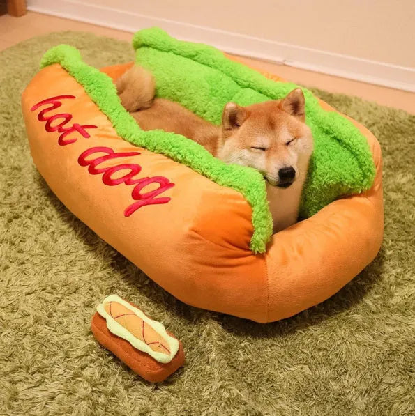 Sofa-style hot dog pet bed with raised sides and a removable cushion in a coffee colour.