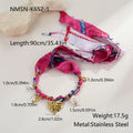 Gold geometric love pendant necklace and matching bracelet set on a white background