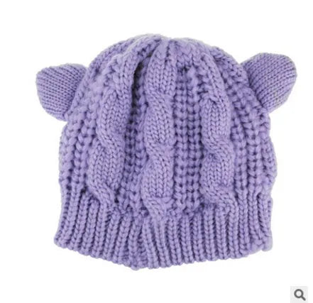 Hand knitted wool cat ear beanie in red colour for winter wear