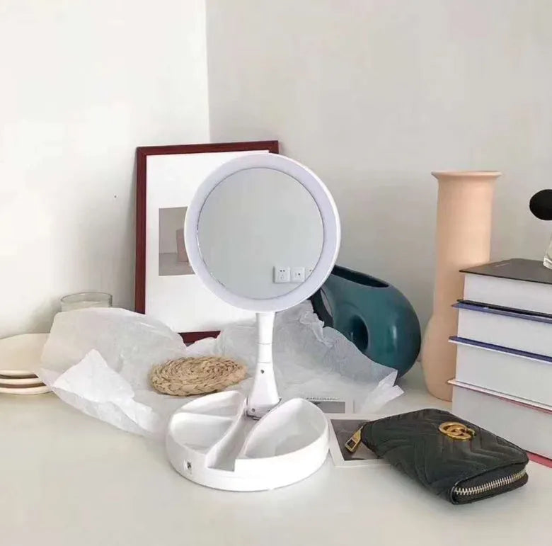 White acrylic vanity mirror with LED lights, double-sided magnification, and foldable design
