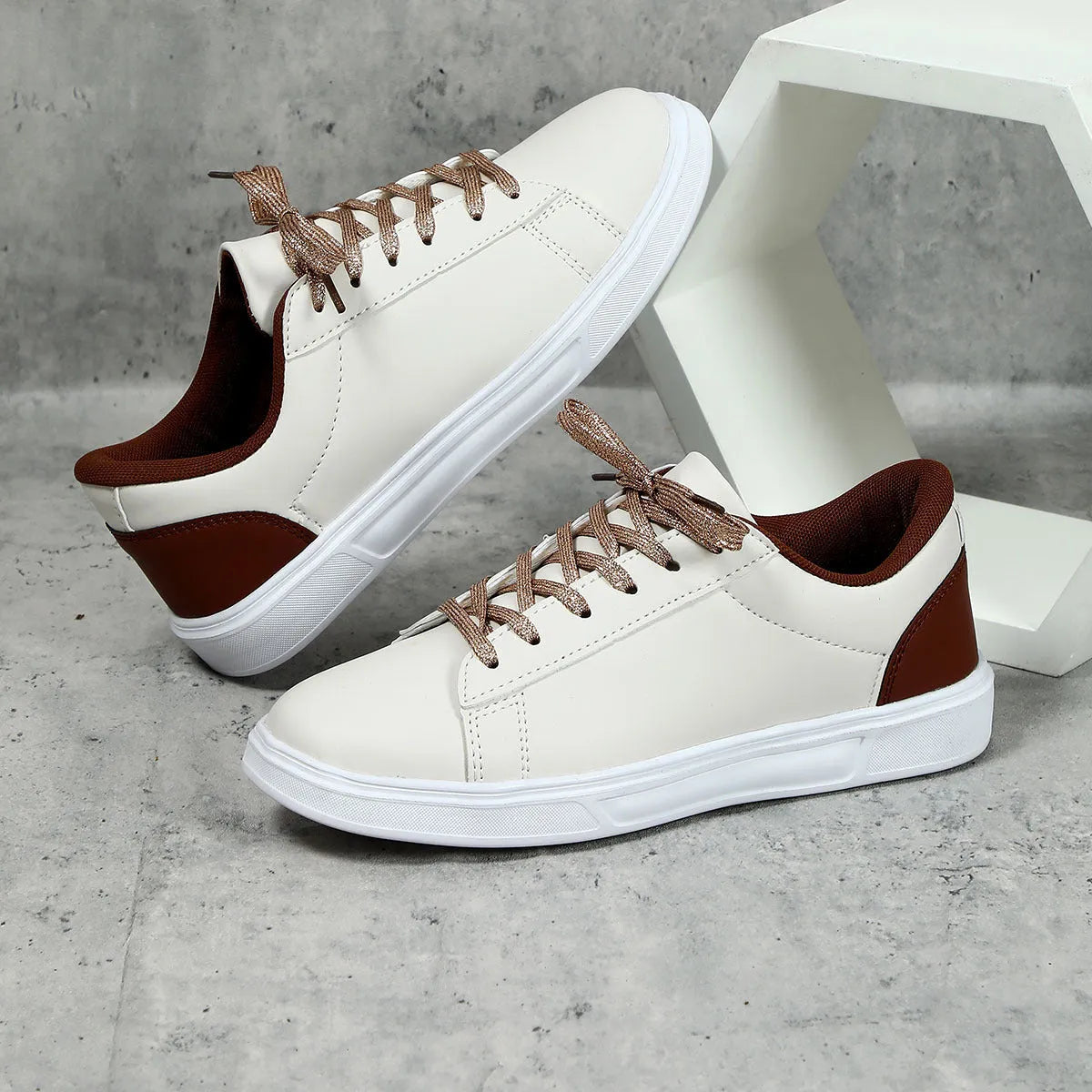 Women's beige brown platform skateboard sneakers with a cross strap and flat rubber sole.