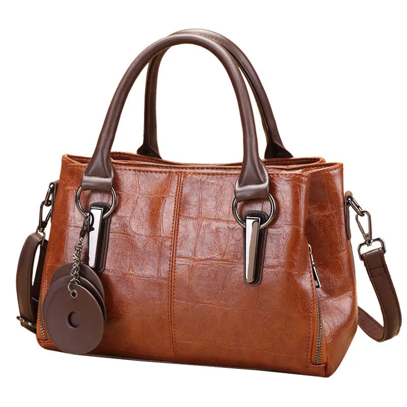 Horizontal square PU leather shoulder bag with contrasting sewing thread detail and organised interior compartments