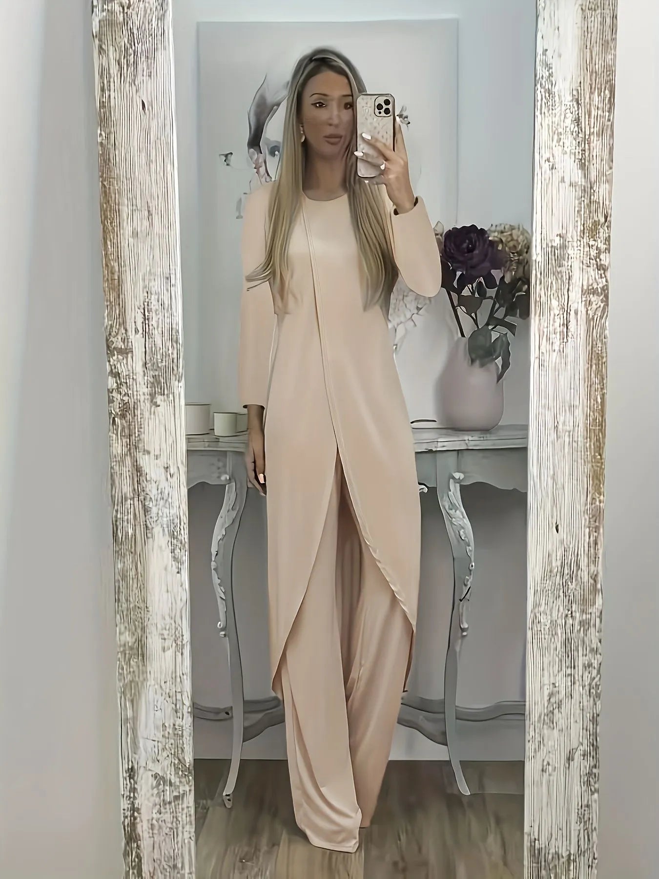 Casual long sleeve polyester two-piece lounge set in black, shown with loose round neck top and trousers.