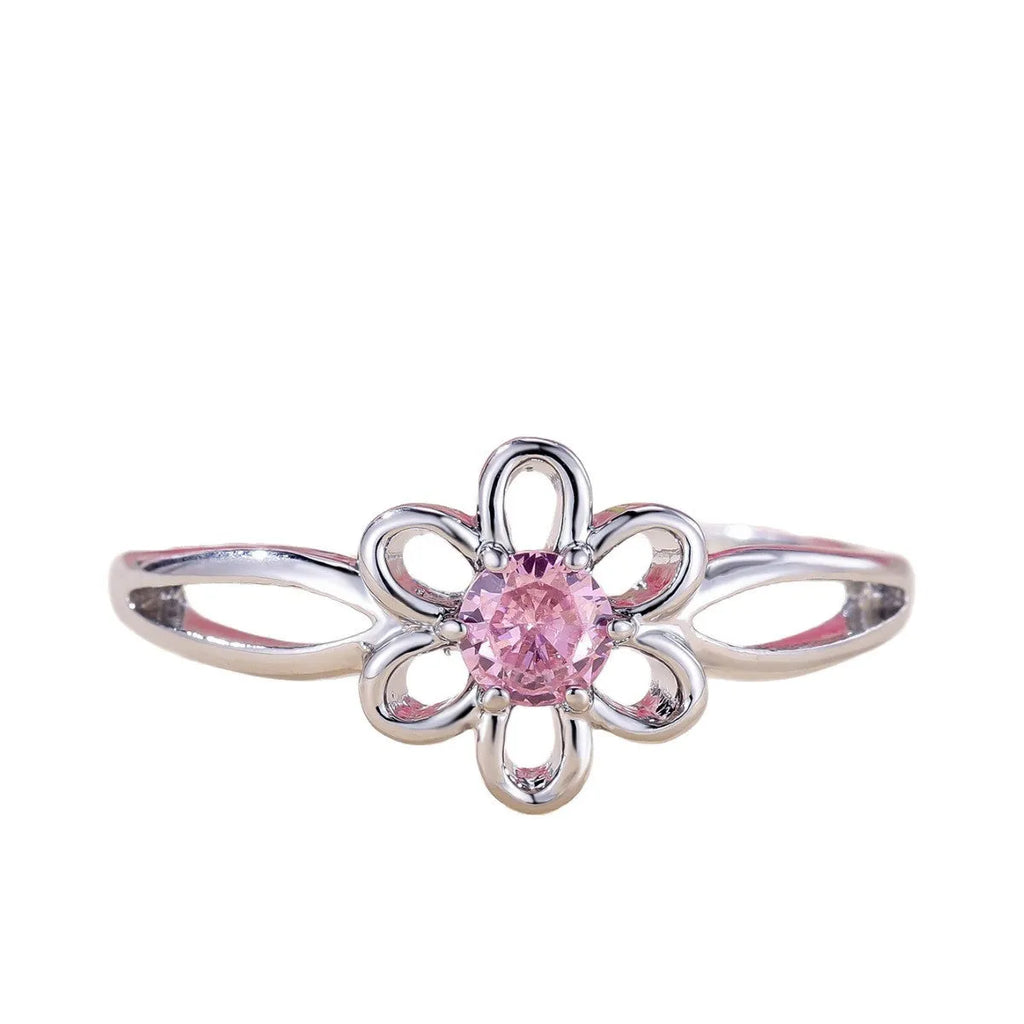 Women's hollow floral ring made from copper with electroplated finish in platinum pink diamond colour