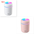 Pink, white or navy blue USB mini humidifier with colourful lights on desk surface
