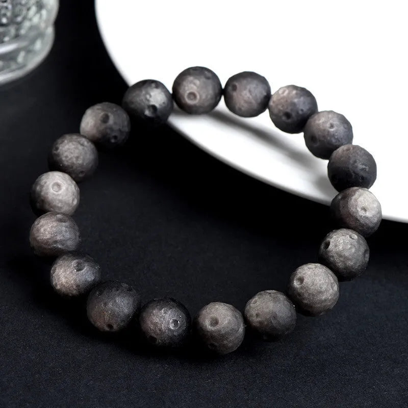 Natural obsidian crater ball bracelet with meteorite texture in silver or gold finish