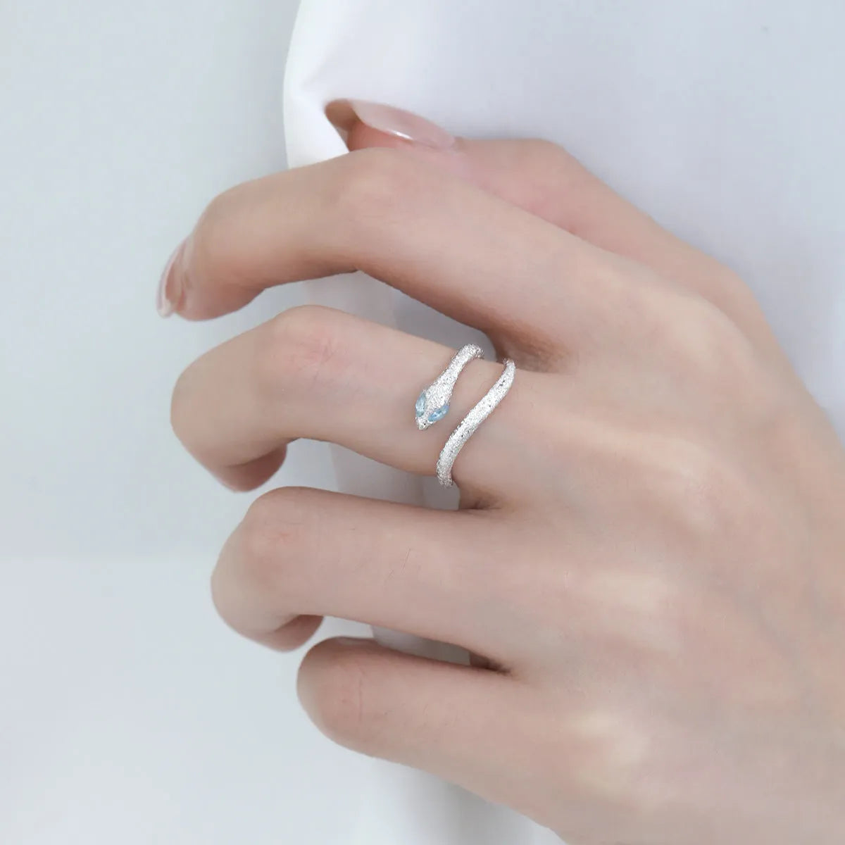 Silver snake zodiac ring with adjustable opening in white gold colour