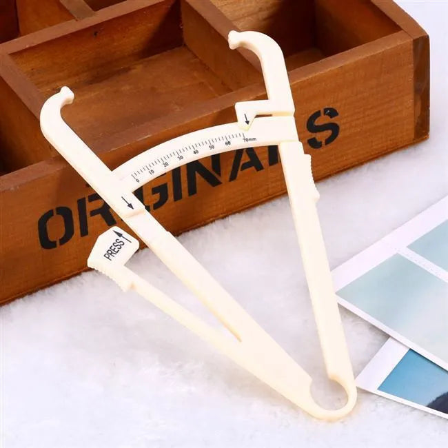 Acrylic body fat caliper skin fold thickness measuring instrument showing measurement scale