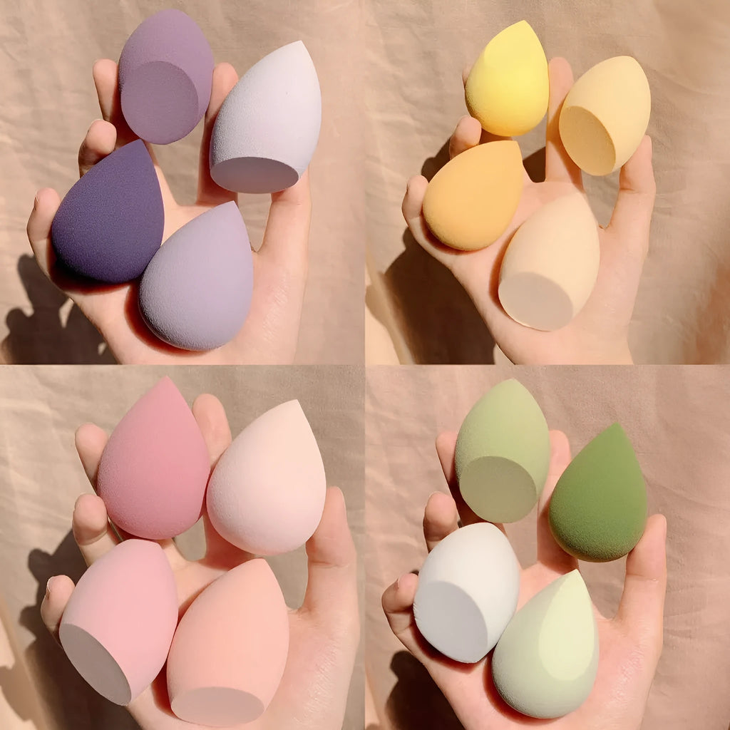Makeup egg box showing four coloured synthetic sponge applicators: Grape, Mango, Mint, and Peach Peach.