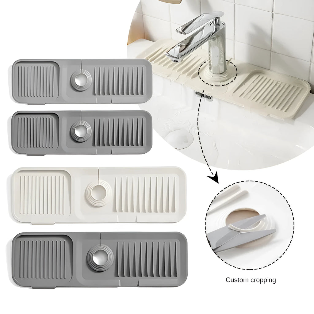 Beige silicone faucet pad with sloped design and drainage channels under a kitchen tap.