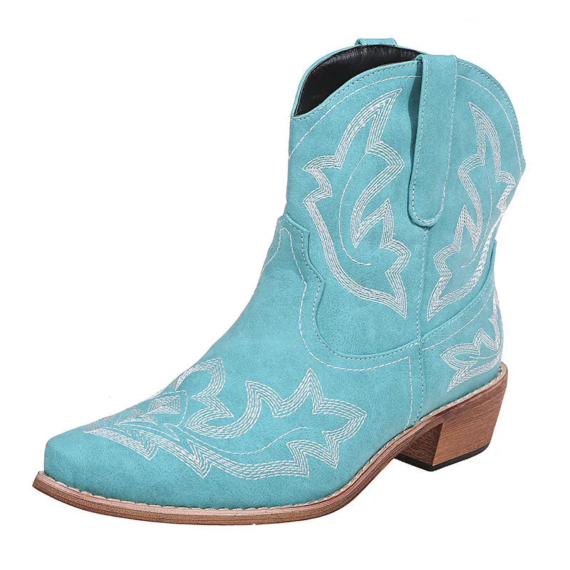 Women's blue embroidered cowboy boots with wedge heel and pointed toe on a white background.