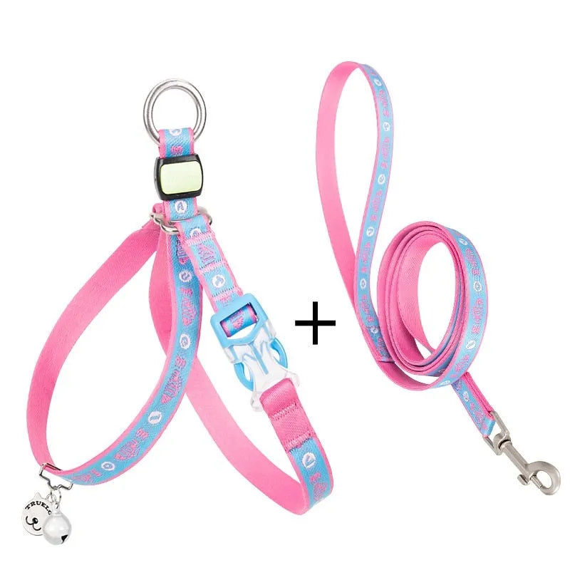 Pet cat bell chest strap and traction rope set in blue polyester jacquard mesh on a small dog