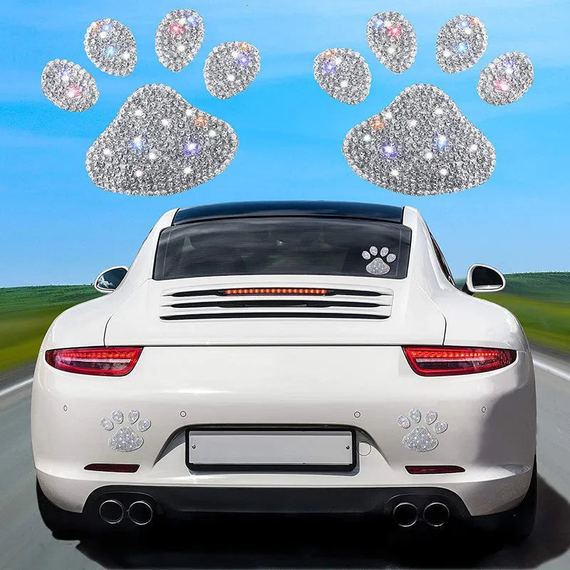 White diamond butterfly and bear claw design glass car sticker measuring 7 by 6 centimetres.