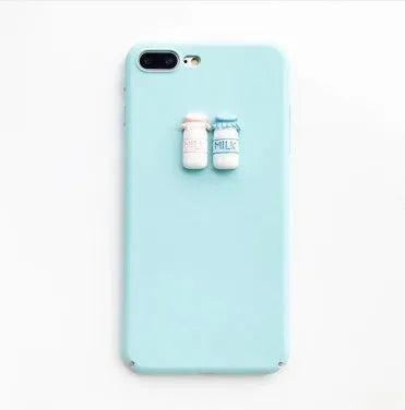 A soft pink silicone iPhone case featuring a raised 3D cartoon cat design on the back.