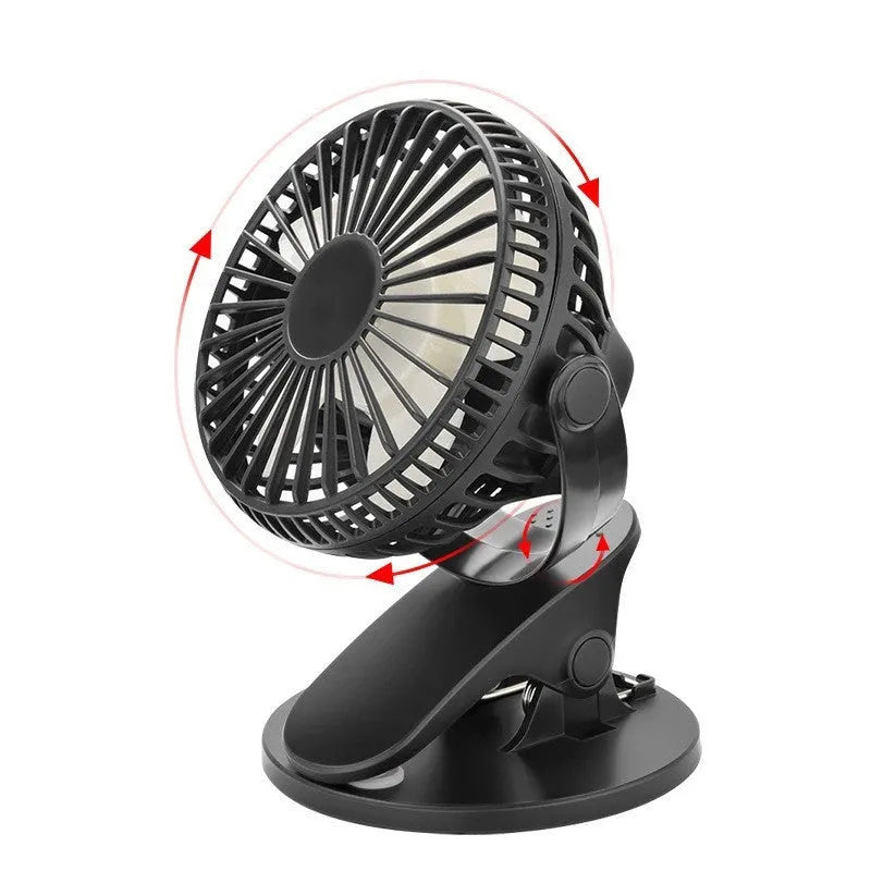 White USB clip fan with plastic blades attached to desk edge showing piano button controls