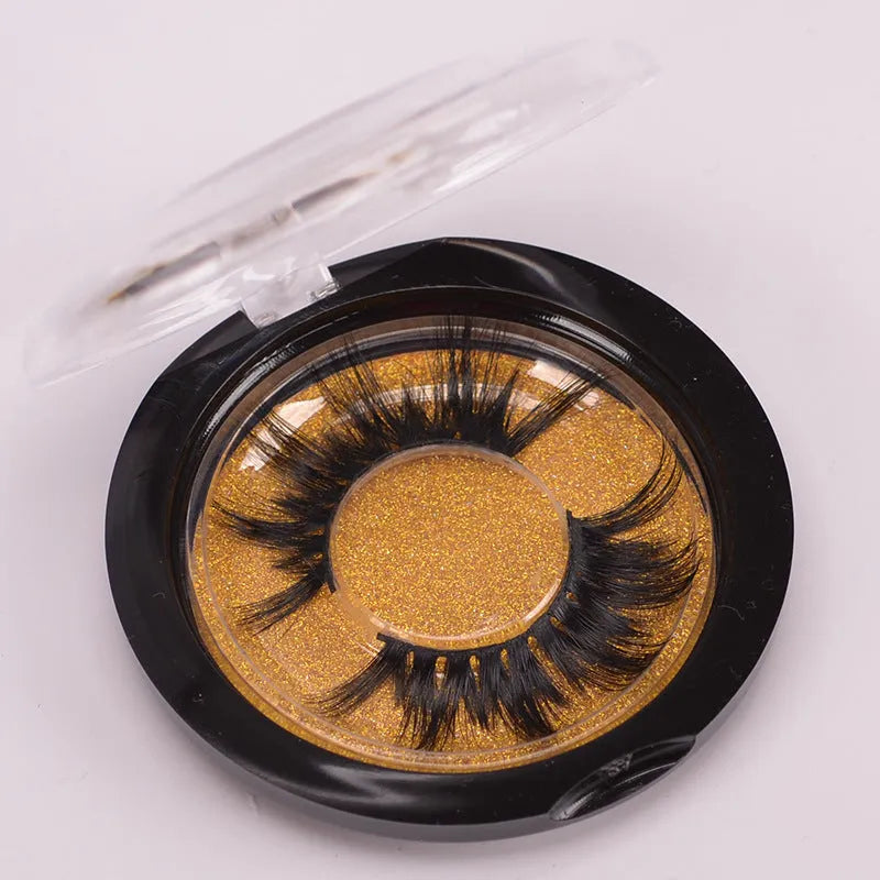 5D mink false eyelashes set with brush and hair cap on black background