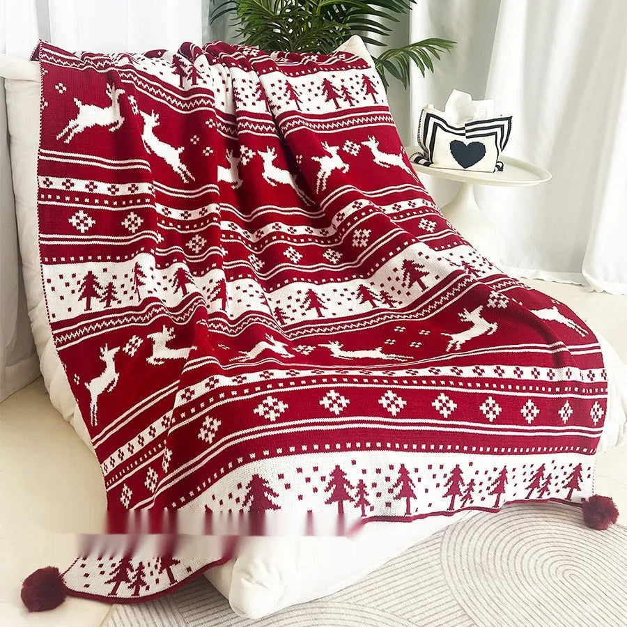 Christmas blanket with cartoon snowflake design in red and white colours