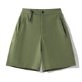 Men's solid colour quick-drying sports shorts with elastic waist on a neutral background.
