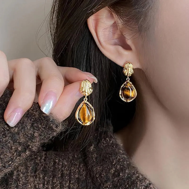 Handmade alloy earrings set showing three geometric designs: irregular amber, wafer disc and water drop tigereye styles