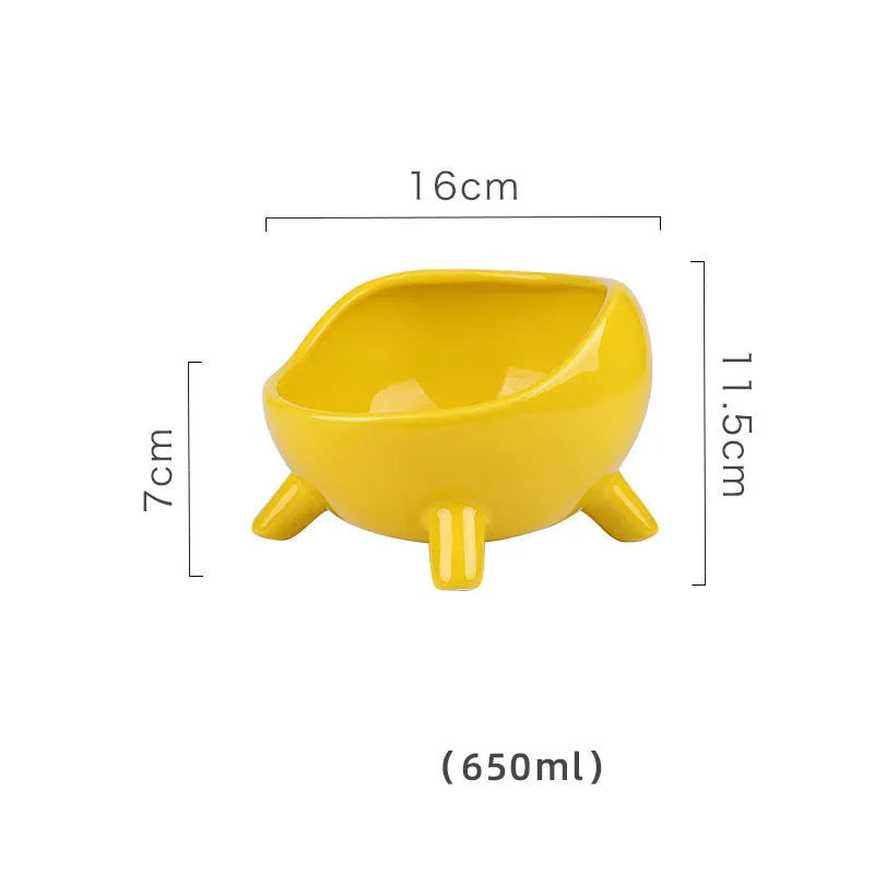 Green four-legged ceramic pet bowl for cats and small dogs on floor