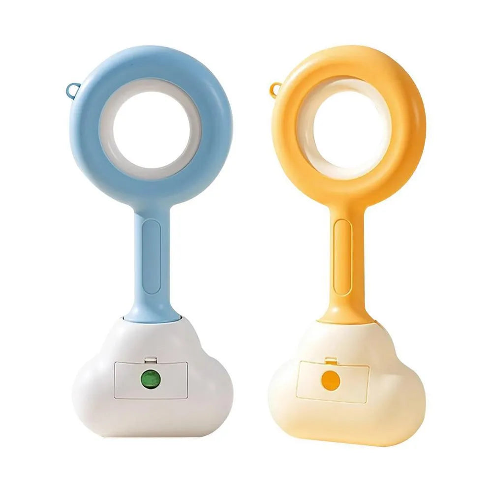 Blue cloud shape jaw dog pooper scooper on a lawn