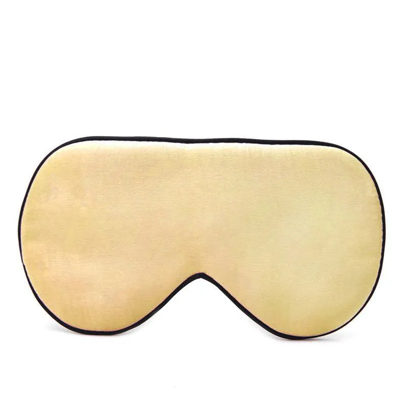 Double-sided mulberry silk eye mask in champagne colour with embroidered print.