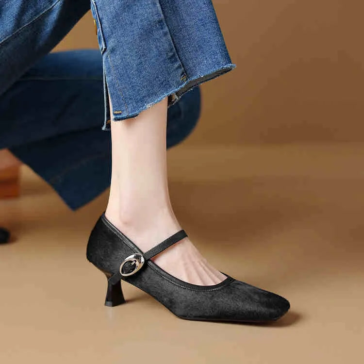Women's black square toe stiletto ankle-strap shoes with horse hair upper and buckle fastening.