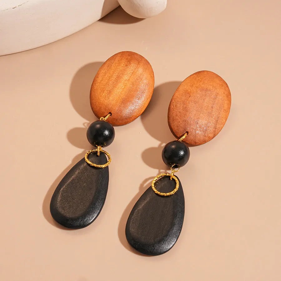 Brown-black wooden ellipse earrings with silver needle detailing in retro European American style
