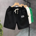 Men's casual sports shorts in solid colours with micro-elastic polyester fabric