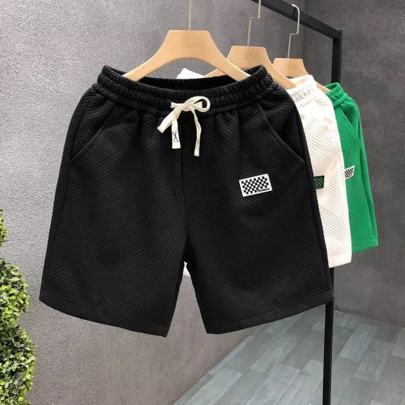 Men's casual sports shorts in solid colours with micro-elastic polyester fabric