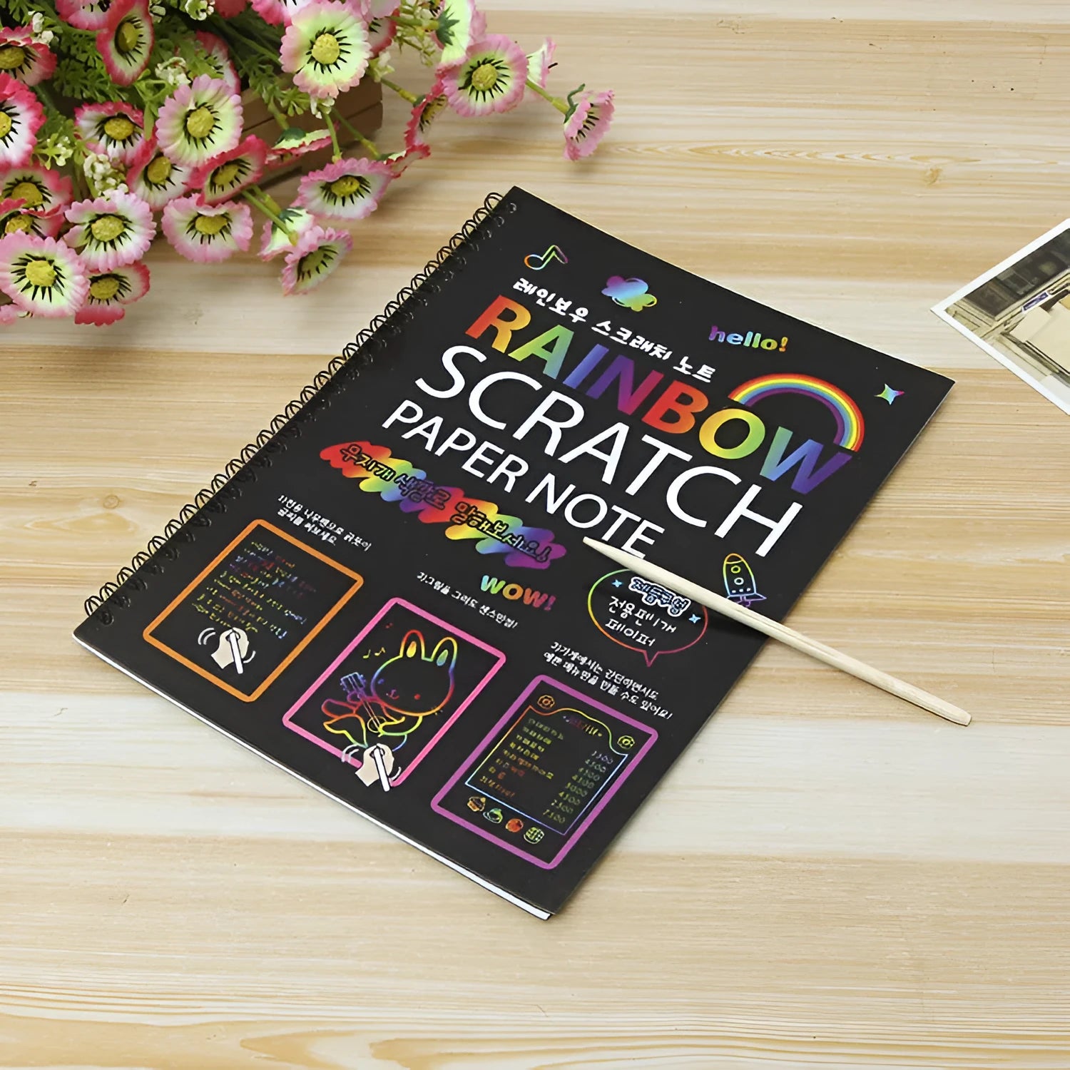Children's large scratch art paper with colourful revealed designs from scraping activity