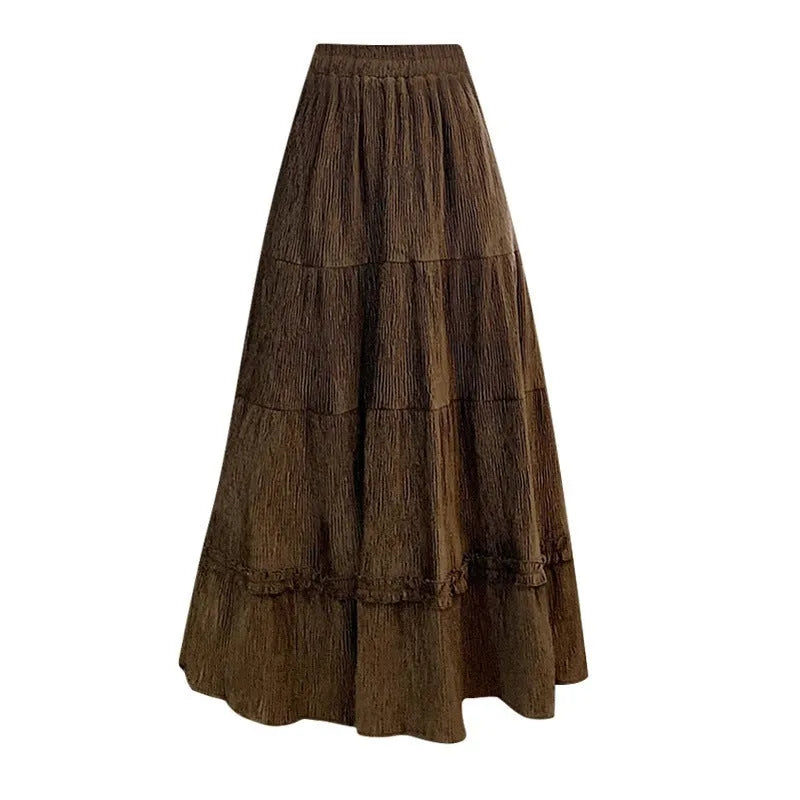 Korean urban style corduroy A-line midi skirt with elastic waistband in milky white colour on a hanger.
