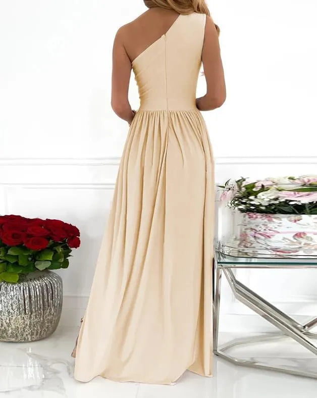 Women's apricot one-shoulder sleeveless maxi dress with high thigh split and cutout detail on mannequin.