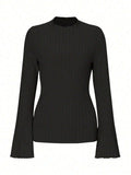 Long sleeve round neck top in black with sunken stripe pattern and lantern sleeves