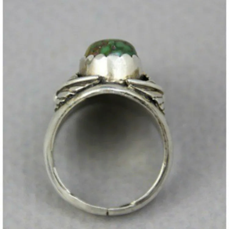 Turquoise geometric women's alloy ring with electroplated finish and retro styling on finger.