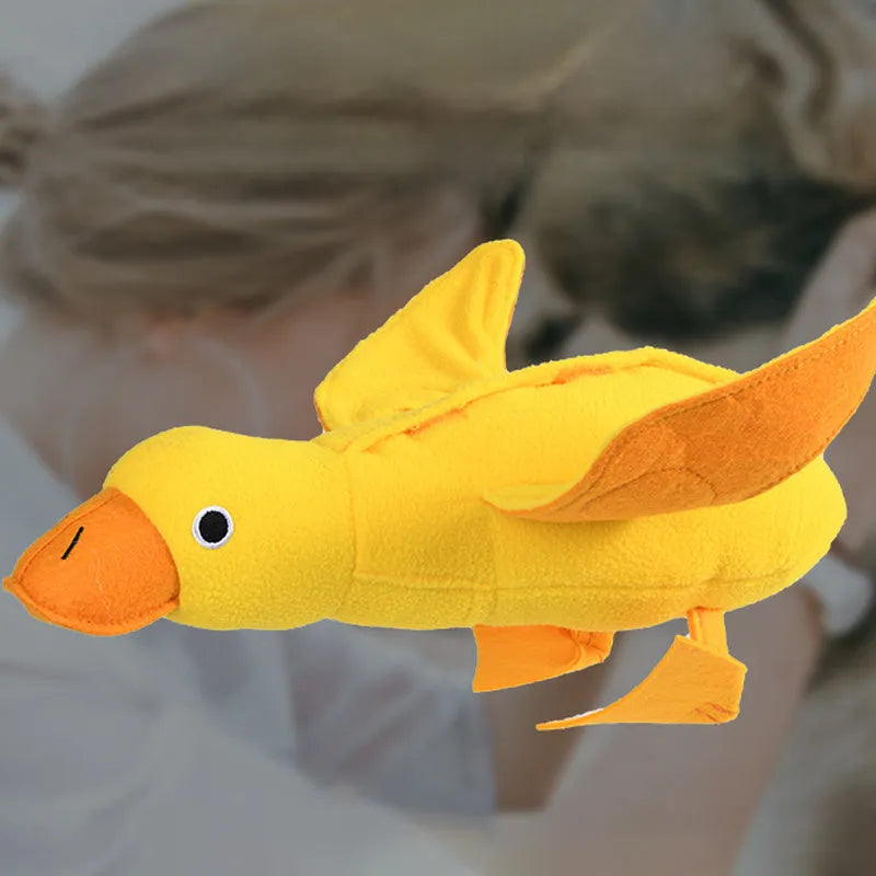 Yellow teddy bear shaped dog toy with food leak compartment and squeaker for training and enrichment